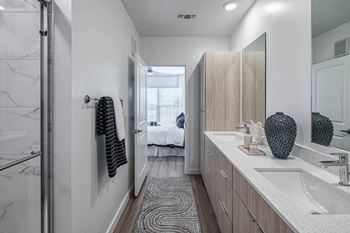 a bathroom with a sink and a mirror  at Altis Grand Suncoast Apartments, Florida